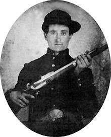 Black and white photo of Hezekiah Blevens in uniform as a Private in Comapny C, 80th Indiana Volunteer Infantry Regiment, circa 1862, enhanced image.