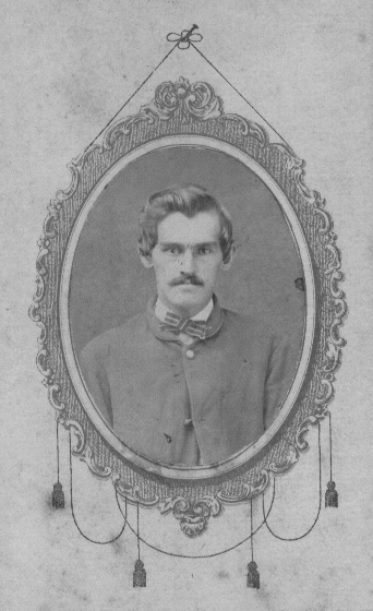 Black and white photo of Corporal William F. Hudleson of Company A, 80th Indiana Volunteer Infantry, in uniform, original image.