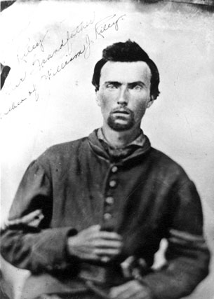 Black and white photograph of Corporal John Reiley of Company B  in his Civil War uniform